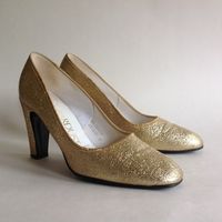 Dolcis Stardust Vintage 1960s Gold Larmé Fabric Court Shoe 3" Heel Shoe is called Sierra. UK 3 EU 36 Condition Is Used- in good Pre-owned condition A beautiful pair of 1960s gold larmé fabric court shoes. Inside measures 9 inches 3.25 inch block heel Clean gold uppers and covered heels along with ivory linings. The soles are very clean with minimal wear No pavement blisters or bruises This item will be posted boxed and sympathetically packaged Dispatched Royal Mail Recorded Vintage Girl NicoleReturns for this item must be sent boxed and properly packaged in the original boxed packaging or similar packaging. Vintage Girl Nicole cannot accept or support returns for this item if it is returned in a plastic mailer.