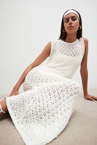 The heat is on. A quintessential summer spirit takes stage in a dreamy white crochet.