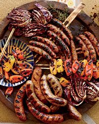 Sausage Mixed Grill - not only a GREAT photo (whose food comes out looking like that? Bet it was nasty and cold - lol) But a good tip for cooking sausages on the grill: spear them with a pair of skewers to facilitate flipping them evenly. Smart!