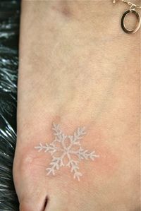 snowflake tattoo... I like the white ink. I want to do this color along with black for my panda tatoo.