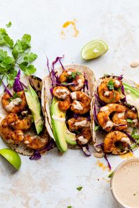 These Blackened Shrimp Tacos are topped with cabbage slaw, chipotle aioli, avocado, and cilantro and ready in just 30 minutes!