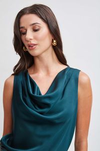 Elie chose his favorite soft-touch Satin for his draped cowl neck Top. Wear it with its matching pleated pants for a chic monotone moment or layered under a blazer with jeans for a modern femme vibe. Elie Tahari Exclusive Satin Cowl Shirt 80% Acetate, 20% Polyester Runs true to Size Length From Shoulder to Hem: Back 24"L (approx. length for size S) Model is 5'9" and wearing size XS Dry Clean Only Imported Style #: E905M504