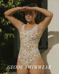 Where flirty feminine prints blend perfectly with sporty flair; meet the Costa One-Piece Swimsuit. This swimsuit boasts a timeless wildflower print on a cream-colored background, paired perfectly with a bold white trim. The details on the open back are enough to make you swoon with thick straps and a classy gold clasp to offer optimal bust support. Our higher leg cut maintains great booty coverage while flattering your curves.