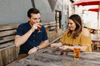 Quirky, personalized engagement photos at a brewery in Deep Ellum part of Dallas, Texas