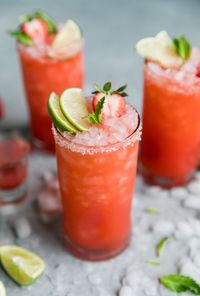 These Strawberry Mint Margaritas are so refreshing and perfect for spring and summer! They're made with a easy mint simple syrup, freshly puréed strawberry juice, tequila, Grand Marnier, and lime juice of course! Pair these with some chips and guac and you're all set! #cincodemayo #margarita #cocktail