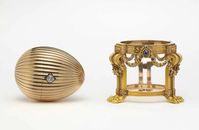 fabergé firm, 1887 | jewels, gold, white enamel, diamond | height 8.2cm | the third imperial egg was created in louis XVI style in the workshop of peter carl fabergé for tsar alexander III who presented it to his wife maria feodorovna on orthodox easter of 1887 | the front of the egg has a diamond in an old-mine diamond clasp which when pressed releases the egg's lid to reveal its surprise: a 14k gold vacheron constantin lady's watch | lost for many years, the egg was rediscovered in 2012