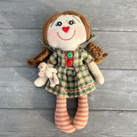 Primitive fabric doll with her teddy bear in tow. Isn't she just darling? Her green gingham dress with the big red stitching is so sweet as well as her braided pigtails!