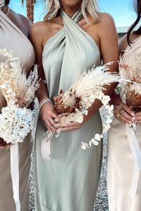 If a gorgeous golden hour feel is on your Pinterest board for your bridal party, look no further than our green moss and champagne bridesmaids dresses! Our newest bestseller, the Jasmine, features a twist halter neckline that is both sophisticated and timeless. For a truly unique look, blend both shades together for a bridesmaids look all your guests will be talking about.