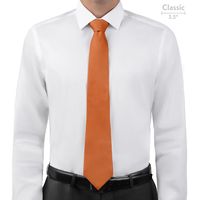 Burnt orange ties combine the joy and creativity of orange with a tinge of grounding brown. The KT Burnt Orange necktie is perfect for autumn.