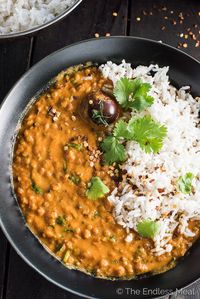 This easy to make Creamy Coconut Lentil Curry takes less than an hour to make (mostly hands off time) and is packed full of delicious Indian flavors. It's a healthy vegan recipe that makes a perfect meatless Monday dinner recipe. Make extras and you'll have a giant smile on your face at lunch the next day. | theendlessmeal.com