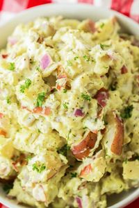 Level up your cookout game with this scrumptious Red Skinned Potato Salad! Perfectly tender red potatoes are tossed in a creamy, tangy dressing and chilled to perfection, creating a side dish that's absolutely irresistible. Pair it with your favorite grilled meats like burgers, hot dogs, or BBQ chicken, and watch it become an instant crowd-pleaser.