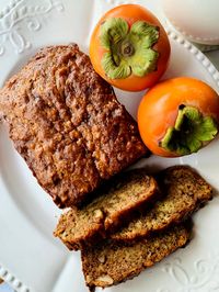 A persimmon quick bread with walnuts.