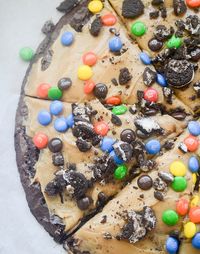 This pizza uses a box of brownie mix as the crust and gets topped with a peanut butter frosting. You can top it off with your favorite candy such as M&M's or crushed Oreos!