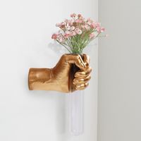 PRICES MAY VARY. Introducing our pride and joy, the Creative Wall-Mounted Sculpture featuring an exquisite hand-shaped design with a stunning test tube vase, adding a unique charm to your home decor. This wall-mounted sculpture beautifully captures the intricate details and texture of a hand, bringing it to life with remarkable realism. Crafted from high-quality materials, it ensures durability and longevity, making it a lasting choice for your home decor. The included test tube vase provides an elegant container for displaying fresh flowers, green plants, or decorative branches, infusing your space with vitality and a natural ambiance. You can easily change the floral arrangements according to seasons or occasions, creating breathtaking and one-of-a-kind floral displays. Whether in the li