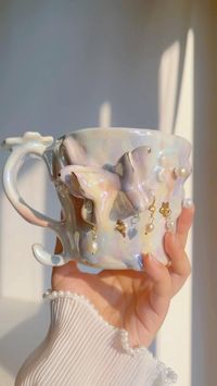 🌟Drop Date Alert! 🌟 This Wednesday July. 24th at 6 PM MST, we’re excited to unveil our latest summer drop. Get ready for a limited release of new works and a restock of a few gothic mugs and golden bow plates 🎀💖 🌟The inspiration behind the Pearl Butterfly Cup was to create something that goes beyond mere functionality. This cup is designed to be a bit ”extra“, pushing the boundaries between the functional and the sculptural. Unlike many modern designs that focus solely on utility, the Pear...