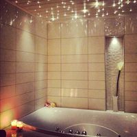 Lights above the bath so you can shut off the regular lights and relax.