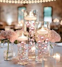 PRICES MAY VARY. Transform ordinary vases into EXTRAordinary Centerpieces with these eye-catching vase decorations, vase fillers, and table scatter. Perfect for wedding centerpieces, bridal showers, baby Showers, birthdays, Mother's Day, Easy DIY gifts, and more... Fills 4 Gallons of 200 Floating Blush Pearls, Floating Matching Gems, and The most Transparent Water Gels. The Pearls & Gems are without holes and Shiny. Contains 2 Packs. In each Pack: 50 Pearls - 6 (28mm/1.10"), 12 (20mm/0.75"), 32