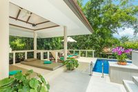 Sun loungers and covered poolside sala