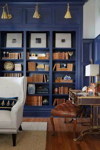 Deep blue bookcase...(The O’More Alumni Showhouse in Franklin, Tennessee. From Traditional Home. Designed by Crysta Parish of Dana Goodman Interiors.)