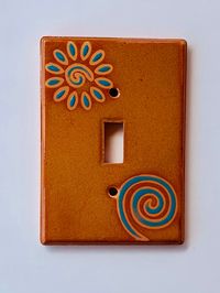 This listing is for Swirl/Flower Turquoise #334 These light switch plate covers add a little touch of functional art to your home decor, hand painted using a variety of ceramic, lead-free, glazes. These are made in Tucson, Arizona. You can choose this design in over 20 standard and hard to find combination configurations. Fired in a kiln at over 1800 degrees, these covers are waterproof and fade resistant; clean with a damp cloth. Each cover comes with nylon screws for easy installation. The bac