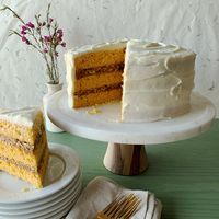 This recipe kicks carrot cake to elegant new heights. Tender layers of carrot-tinted spice cake are sandwiched with a luscious coconut-pecan filling—and it's all covered in swirls of classic cream cheese frosting.