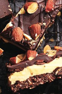 Some of our kitchen team find traditional Nanaimo bars too sweet, so we developed a bar we all could love. Thanks to cocoa powder, salted almonds and much less sugar, we got it.