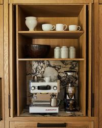 DISC Interiors on Instagram: "Cappuccino or espresso? Details from a recent kitchen we designed, hidden appliance garage for the @lamarzocco.usa Home of @tyronemckillen and @christinamckilliano , featured by @archdigest photographed by @samfroststudio #DISCinteriors #interiordesign #kitchendesign #kitchen #losangelesinteriordesigner"