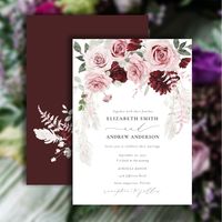 The Wedding Invitation is a stunning work of art that showcases the beauty of nature in all its splendor. The rich burgundy color palette is complemented beautifully by the soft and delicate blush pink roses and the natural, earthy tones of the pampas grass, creating a sense of harmony and balance that is truly breathtaking. The addition of elegant calligraphy adds a touch of sophistication and refinement, creating a sense of timeless beauty and elegance that is both striking and romantic. This