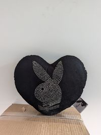 This is an authentic vintage Playboy  pillow. Great gift for any playboy fan. Dimension is approximately 12 inches in height. Genuine vintage item and will have some signs of wear and tear including but not limited to tears, holes, stains, loose and pulled threads, etc. These are no longer made or sold and stores and the condition is second hand vintage. 4