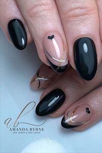 Give your nails a touch of love with these chic black French tips by @amanda_byrne_nailartist, featuring tiny black heart nail art, delicate silver lines, and a hint of gold glitter. Elevate your manicure game with this stylish and romantic design that’s perfect for expressing your unique flair.