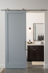 Who knew a door could make such a statement? This sleek sliding bathroom door isn't just a space-saver; it's a style enhancer! 🌟 Check out our blog for 12 ingenious bathroom door ideas that are perfect for small spaces. They're guaranteed to add function and flair to your tiny abode! #GoTinySpace #BathroomDoorIdeas