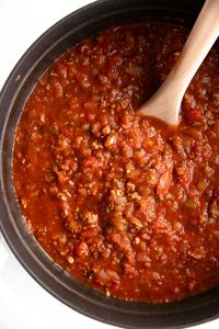 This Homemade Spaghetti Sauce Recipe is so hearty, delicious, and easy to prepare you'll never want to buy the jarred stuff again. Made with simple ingredients like ground beef, onions, and tomatoes, Learn How to Make Spaghetti Sauce right at home and enjoy with pasta or cooked into your favorite recipes like stuffed peppers and lasagna.