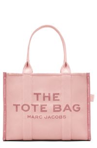 This roomy, lightly structured canvas tote is stitched with bold branding and topped with webbed straps that allow for comfortable shoulder carry. Top zip closure Shoulder straps Interior zip pocket Softly structured silhouette with flat base for stability Unlined Textile Imported