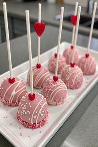 Valentine's Day Oreo Pops Recipe  Ingredients  - 1 package Oreo cookies - 1 package (12 oz) white chocolate chips - 1 tablespoon coconut oil - Sprinkles or edible glitter for decoration - Lollipop sticks  Full Cooking Instructions on...