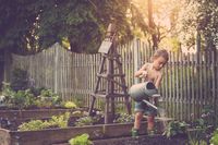 #kimwineyphotography #lepotager #garden #childrensportraits #lancastercounty #pennsylvania #wateringcan #obelisk #sunset