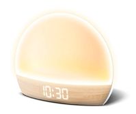 Rise and shine with rejuvenated vibes when you wake up to this sunrise-simulating alarm clock featuring a sleek wood-look design. Warm LEDs illuminate the time while emitting a cozy amber glow ready to help you take on the day.