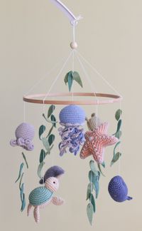 "Ocean baby mobile with Whale, Jellyfish, Turtle, Stingray fish, Crab, Starfish and Octopus is perfect for a nursery in ocean style. Your baby will love it! This baby mobile is very modern and will be a wonderful gift for baby shower, expecting mom and newborn! Crochet products have strength and wear resistance. It is perfect for the baby's itchy gums - great to grasp and chew. Your baby is sure to be delighted! Games with natural toys help develop children's motor skills, hand-eye coordination