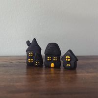 A tiny haunted village.  -hand sculpted from polymer clay -black and yellow   - first house - 1 1/4" tall 3/4" wide - second house - 1 3/8" tall 3/4" wide - third house - 3/4" tall 1/2" wide   Handcrafted in a tiny Maryland studio. All items from Smoke & Salt are made in small batches.