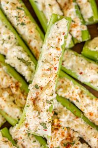 Italian Cream Cheese Stuffed Celery - outrageously good with only 5 ingredients! A party favorite! Can make in advance and refrigerate until ready to serve. Celery, cream cheese, Italian dressing mix, mayonnaise, and mozzarella cheese. This is always the first thing to go! Great for game day, parties, potlucks, and the holidays! #celery #appetizer #gameday #thanksgiving #christmas #stuffedcelery