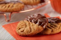 These chocolate-dipped peanut butter cookies taste so good, you'd never guess they were made from a peanut butter cookie mix. Get the recipe.