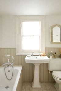 Tongue and groove panelling in the bathroom painted in shades of Dulux Chalky Downs. Full details on Modern Country Style blog: Swedish/French Style Victorian House Tour