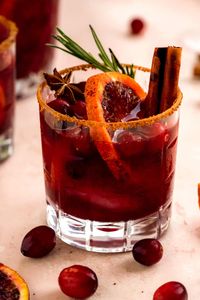 What better way to get into the holiday spirit than with Blood Orange Cranberry Sangria! Nothing livens up a gathering (big or small) like a big batch of sangria outfitted with fresh fruit, a little ginger beer, and a generous dose of some classic fall flavors. It's easily made in a big pitcher and gets even better with time to soak up all the juices! In other words, it's a holiday party must!