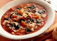 This homemade meatless tomato barley soup recipe with carrots, celery, and spinach is low fat, high fiber, cholesterol free, and vegan.