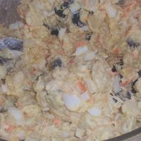 A fluffy seafood-potato salad which can be served anytime. This is a fancy version of the salad that's on every respectable plate lunch in Hawaii. Feel free to substitute a can of tuna, a can of baby shrimp, or 1/2 lb. of shredded imitation crabmeat for the real stuff.