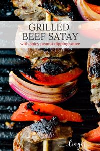 These lip-smacking beef satay skewers bring a bit of heat with both the marinade and the spicy peanut butter dipping sauce. A flank steak recipe perfect for dinner or an appetizer. #beefsatay #beefskewers #peanutsauce 