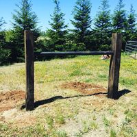 Hitching post made of Railroad ties and steel pipe. Horses can't pull this one out!