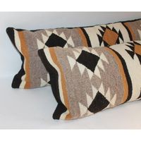 Pair of Navajo Indian weaving bolster pillows in fine condition. The backing is in cotton linen backing.