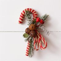 Add a little whimsy to your holiday decor with our Candy Cane with Rusty Bells & Berries. Standing at 7.5" tall and 4.5" wide, this festive decoration will bring a touch of playfulness to any room. Hang it on your tree or use it as a unique accent piece - it's sure to be a hit!