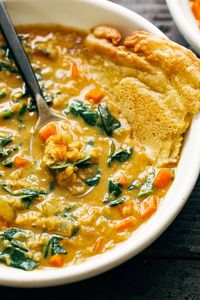 Smoky Red Lentil Soup with Spinach! This Smoky Lentil Soup is ultra creamy and totally vegan! Packed to the brim with veggies, red lentils, coconut milk, and lots of spices, it's a total win for the coziest months of the year! #redlentils #vegan #soup