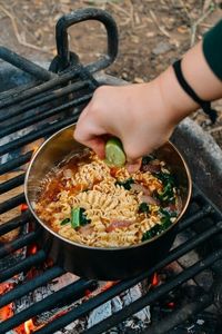 Camping Pho ramen is made with instant beef-flavored ramen, a healthy amount of beef jerky, red onion, leafy greens and a generous squeeze of lime juice!